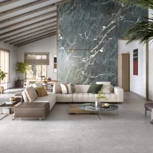 Lux Euphoria - Living room with green marble look and light concrete look on floor and wall, Pamesa