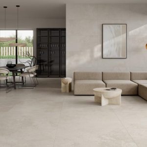 Pietra Di Rapolano - Woonkamer en eetkamer met lichte betonlook op vloer en wand, Pamesa