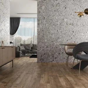 Pietra Di Gre - Living room and dining room with terrazzo and wood look on walls and floor, Pamesa