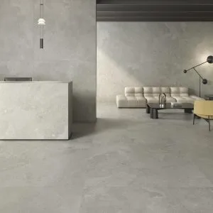 Portlandstone - Hotel reception and office with grey concrete look on floor and counter, Pamesa