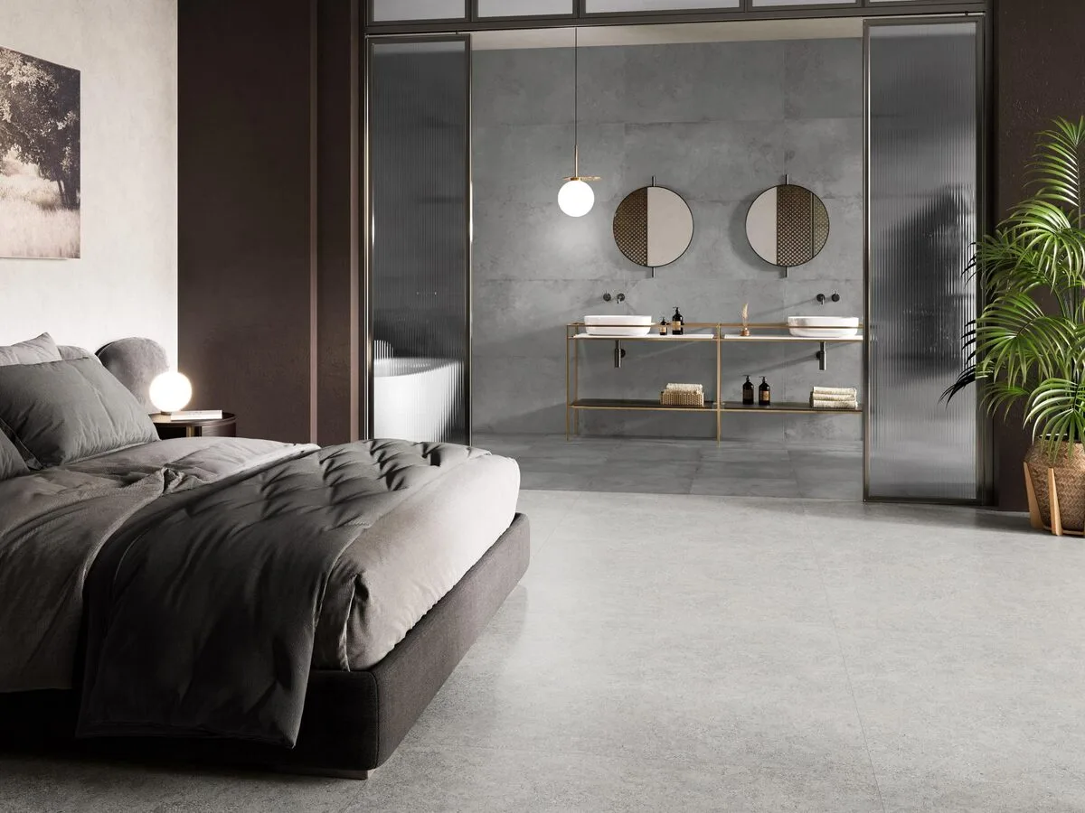 CR. Moleanos - Bedroom and bathroom with grey concrete look on floor and wall, Pamesa